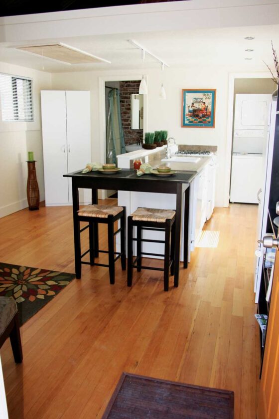 At only 275 square feet, the SoDo 4 homes need space-saving features such as a stacked washer and dryer, a sliding bathroom pocket door and a hidden ladder to the sleeping loft to maxmize their floor space.